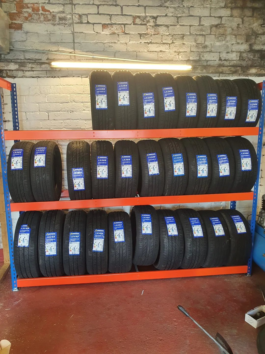 Rows of tyres on the racks inside Carr Tyres
